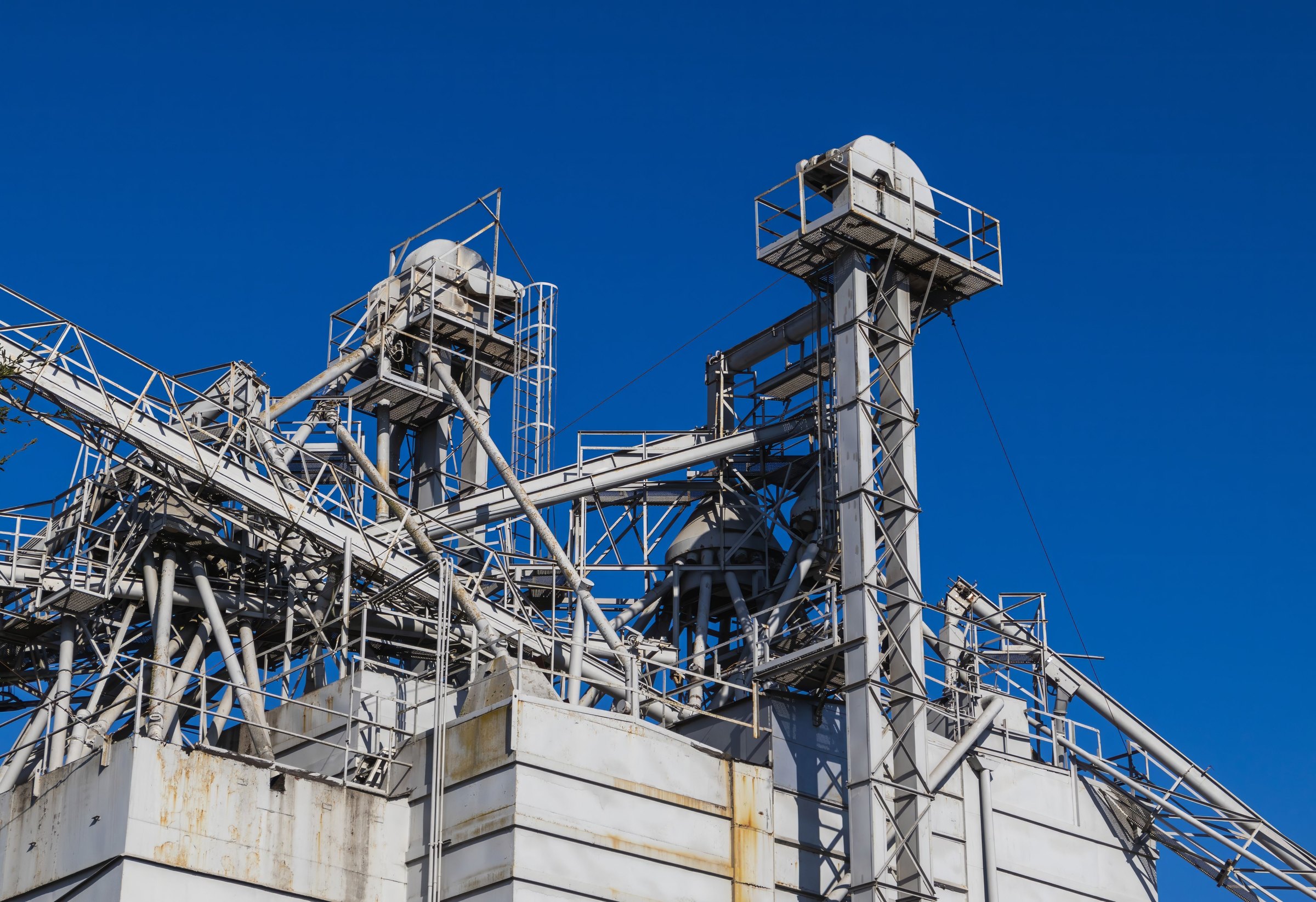 Large industrial structures and pipework, shown as capability context